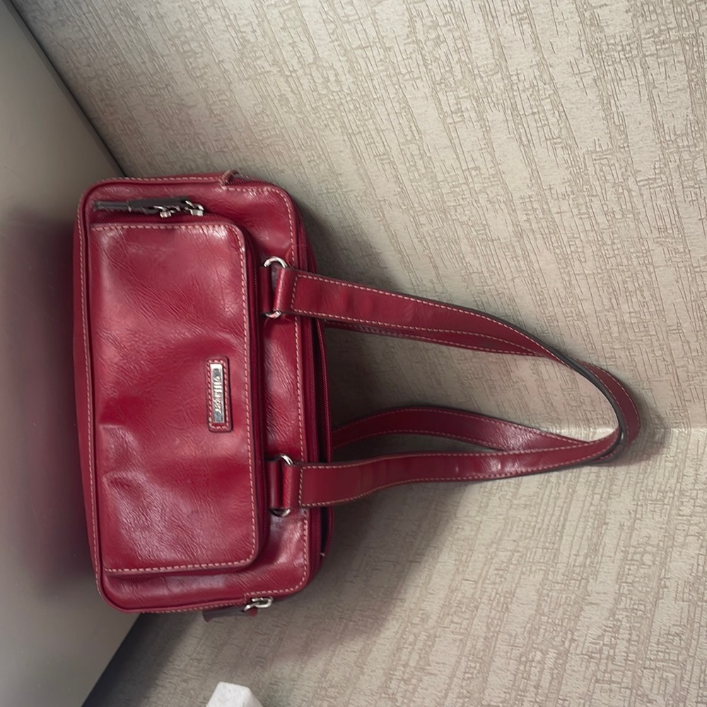 a purse, red, leather brand- “Villager”